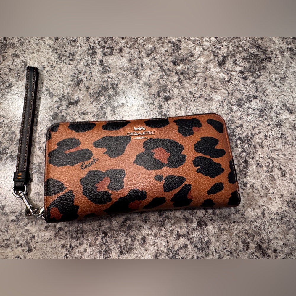 Coach leopard long zip around wallet wristlet. Used very good condition.